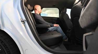 Audi S6 Avant e-tron - rear seats with Auto Express Chief reviewer, Alex Ingram